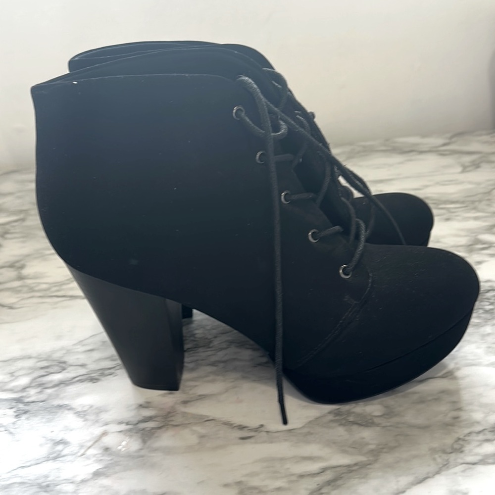 High heels. All black. Never worn